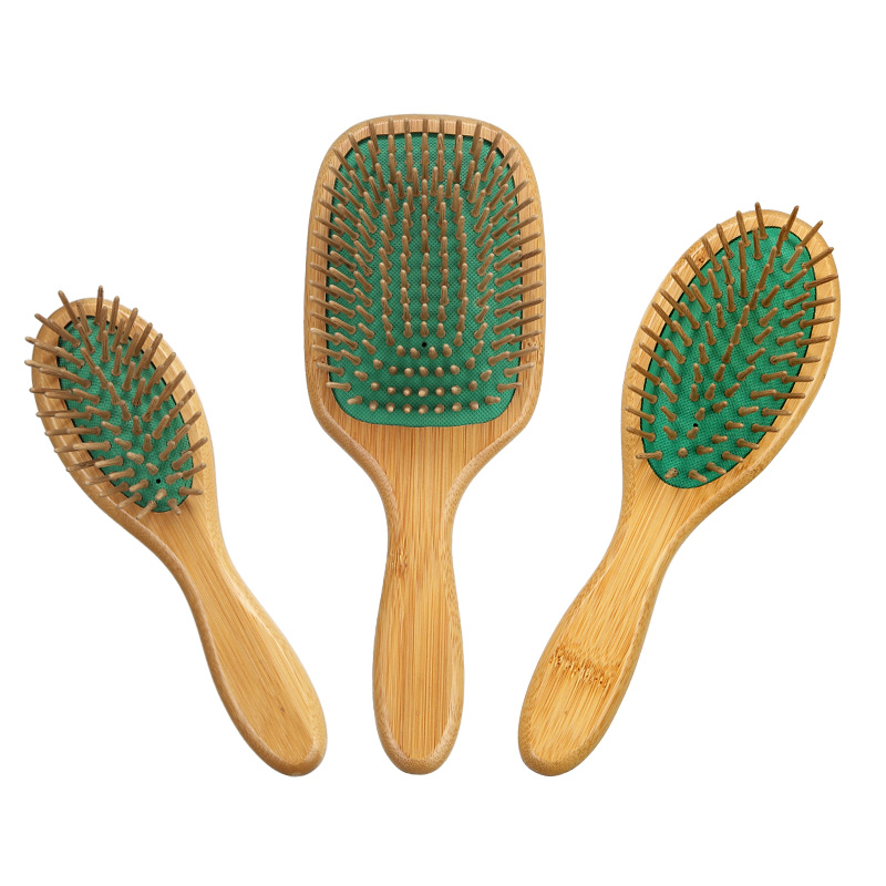 Cepillo de pelo de paleta de bamb&uacute; ecol&oacute;gico coj&iacute;n verde con pasadores de madera