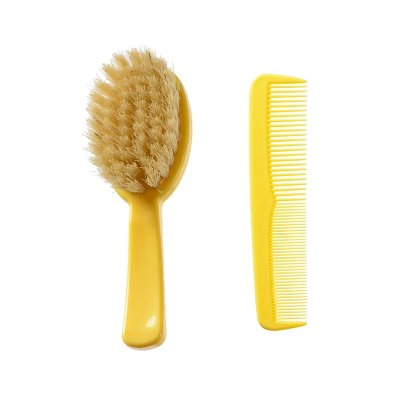 Cepillo de pl&aacute;stico amarillo para beb&eacute; con juego de cerdas de jabal&iacute;